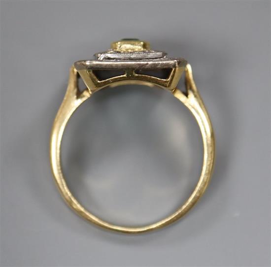 A modern 18ct gold, emerald and diamond chip cluster tablet ring, size O, gross 4.9 grams,